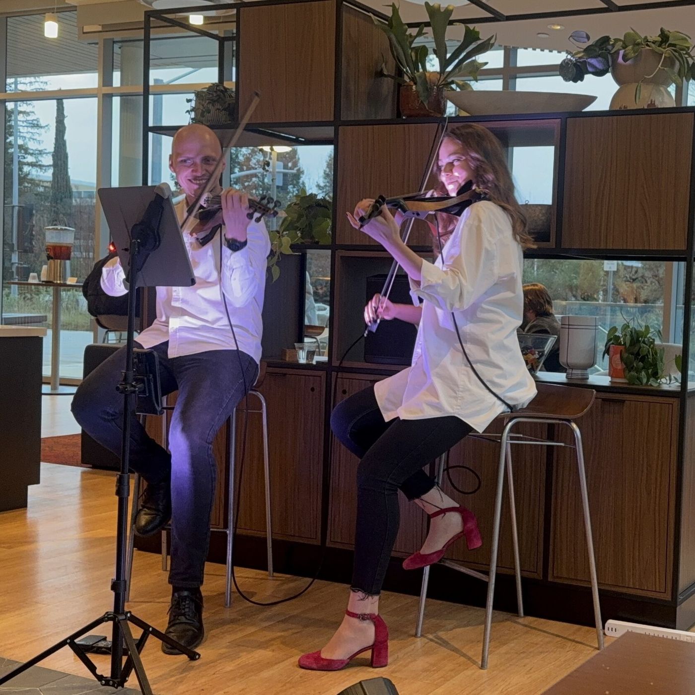 The duo performing at an indoor event